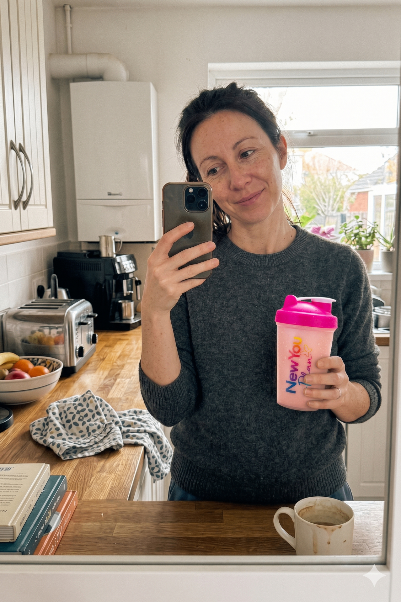Customer with New You Plan shaker in kitchen